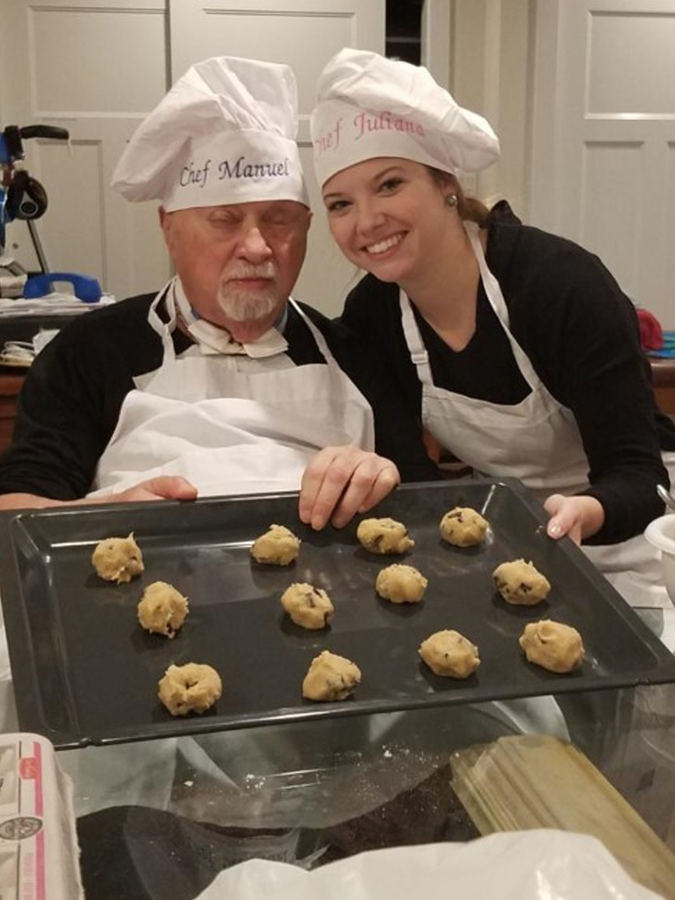 senior man and therapist baking cookies